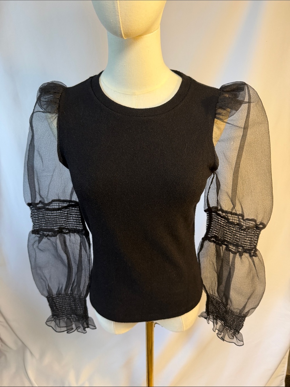 Black Puff-Sleeve Sheer Mesh Knit Top. Snag noted on back left arm as shown.